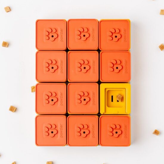 Pawzler Treat Maze a orange and yellow puzzle that can be rearranged to different maze designs.